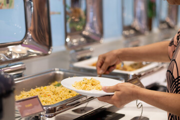 scooping the food, catering, dinner time