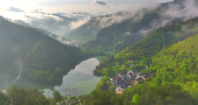 Aerial photo of Tonglu Mountain Village in Hangzhou, Zhejiang, China, surrounded by clouds and mist in the early morning