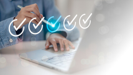 Businesswomen tick mark an assessment, questionnaire, evaluation, online survey online exam choose the right answer in the exam, filling out an online survey form. Answer the test questions concept.