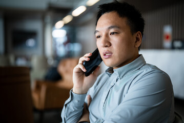 businessman using mobile phone in open office