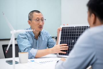 businessman coworking on solar panel