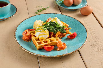 Elegant Breakfast: Viennese Waffles with Poached Egg and Smoked Salmon Garnished with Fresh Tomatoes