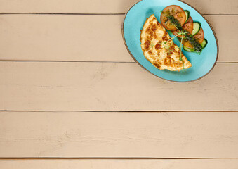 Classic French Vegetable Omelette on Wooden Table