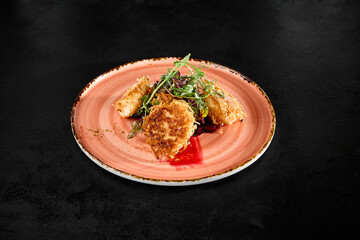 Tempura Fried Cheese with Beetroot and Greens on Rustic Plate Against Dark Background