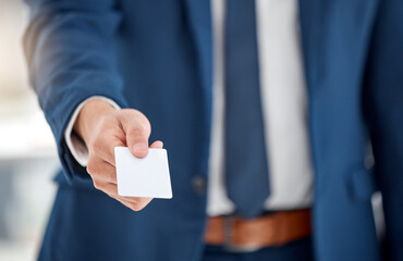 Hand, offer and man with business card in office for company contact information or referral. Mockup, giving and male person with blank space for paper ticket with career networking or promotion.