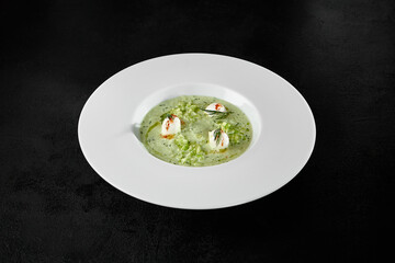 Elegant Cold Cucumber Gazpacho Soup with Mozzarella Cheese in White Bowl on Dark Background