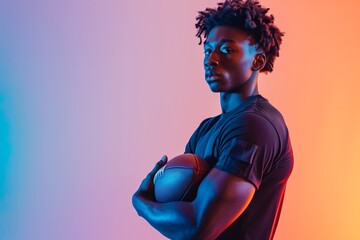 Athletic African American Man Holding Football in Neon Lights