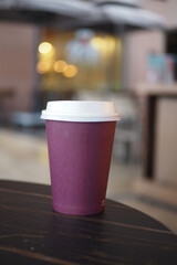  red color take away kraft coffee cup on table ,