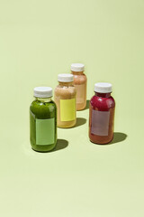 Colorful Detox Juice Bottles in Minimalist Concept Pattern - Fresh Vegetable and Fruit Drinks Cleanse Program