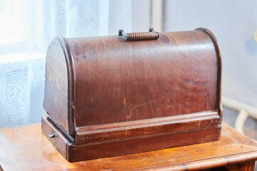 Vintage vintage mechanical sewing machine in a wooden case. The beginning of the 20th century.