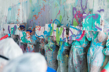 Shooting with liquid acrylic paints in the room. Child's play