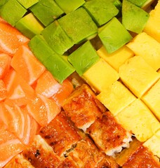 colorful sashimi rice bowl texture avocado cubes chopped salmon eel unagi don bento top view
