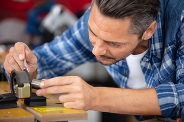 engineer inserting a bearing held in a clamp