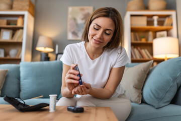 Blood sugar testing at home. Checking Blood Sugar Level At Home. Diabetic Checking Blood Sugar...