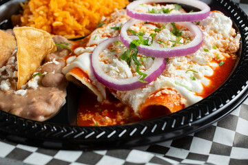 A closeup view of an enchilada plate.