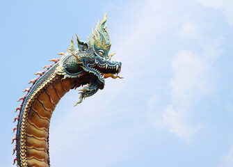 Statue of Naka Buddha on sky background