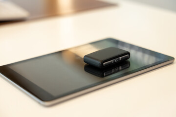 Tablet and car keys laying on the table