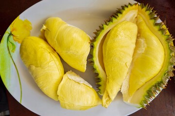 Durian is a king of fruit in Thailand and asia fruit have a spikes shell and sweet can buy at Thai street food and fruit market at agriculture farm
