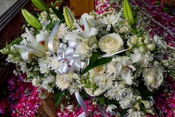 close up photo of a bucket of white roses