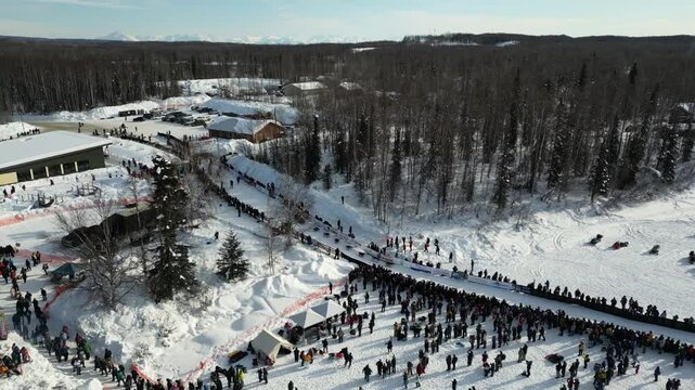 4K drone footage capturing the start to the historic Iditarod dog sled race in Willow Alaska.
