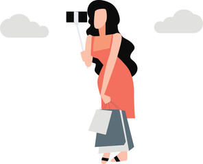 Girl taking selfie with her shopping bag.