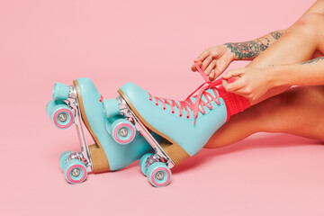 Close up cropped photo shot of young woman sit lace up modern blue rollers rollerblading isolated...