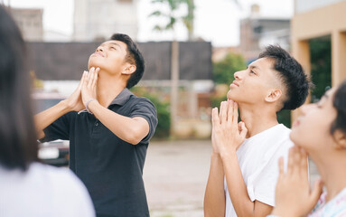 Young Asian People Doing Stretching Neck Doing Warm Up Together Outdoors In A Park 