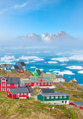 Picturesque village on coast of Greenland - Colorful houses in Tasiilaq, East Greenland © muratart