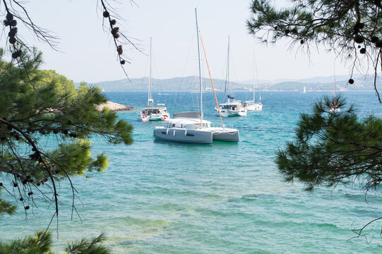 Sailboats anchored near the Adriatic coast, summer vacation, in Vrgada, near Pakostane, Croatia