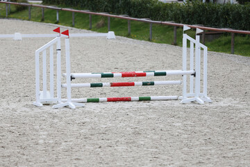  Horse obstacle course outdoors summertime. Poles in the sand for equestrian event