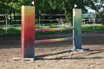  Horse obstacle course outdoors summertime. Poles in the sand for equestrian event