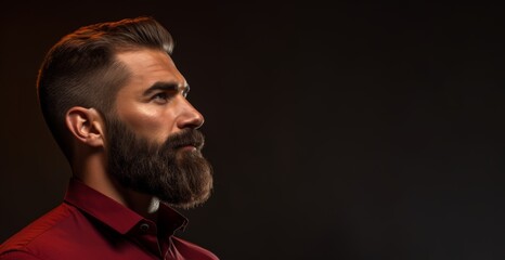 Obraz premium Trendy man with a perfectly lined beard and mustache on a dark maroon background