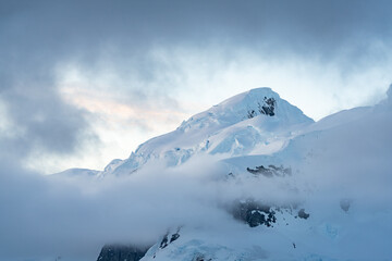 Icy mountain peak at sunset, Antarctic Peninsula, Antarctica
