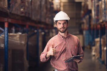 Warehouse worker working in warehouse storage. Foreman or worker work at factory site check up products in site. Inventory worker working in factory Storehouse