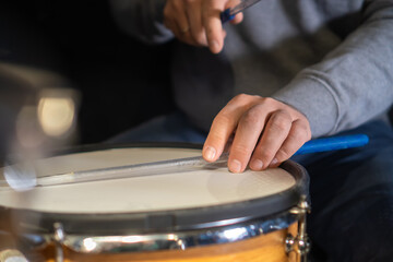 Drummer behind the drums in the studio, at a concert. Professional drum kit in close-up.