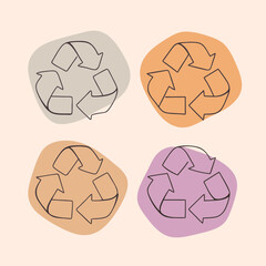 Four colored recycling symbols on pink background