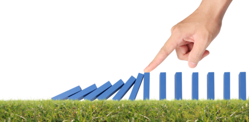 Hand stopping the Domino effect stopped by unique