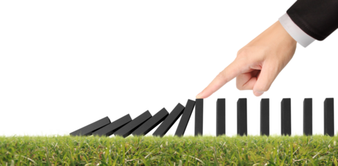 Hand stopping the Domino effect stopped by unique