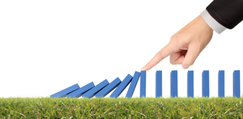 Hand stopping the Domino effect stopped by unique