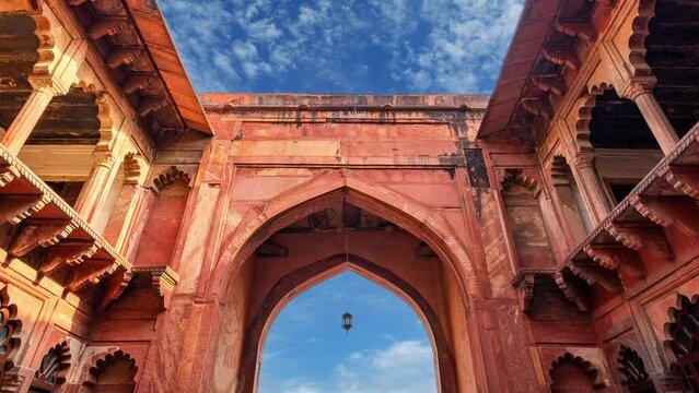 Agra fort gate time lapse on a blue sky day. Agra, India.