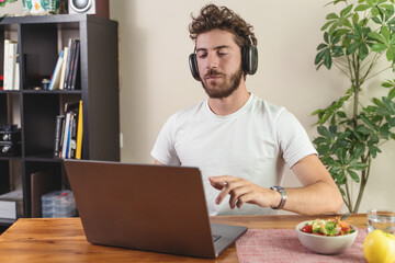 Man Working from Home with Laptop - Remote Work and Healthy Lifestyle