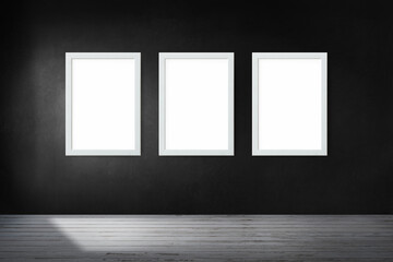 White picture frame mockups hanging on a black wall
