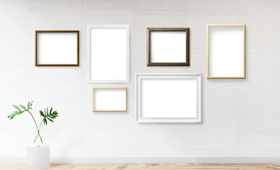 Blank picture frames mockup on an off white wall
