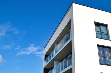 Modern Polish residential buildings stand tall, showcasing sleek architecture and contemporary design. These apartment blocks, available for purchase through credit, offer a perfect blend of style, co