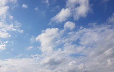 Summer blue sky and white clouds on a sunny day, heaven background