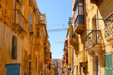 Street with historic buildings in old town of Malta