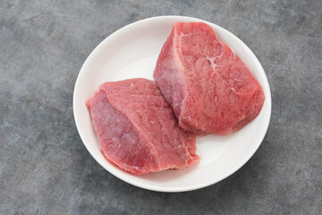 Fresh raw beef (daging sapi), food preparation.
