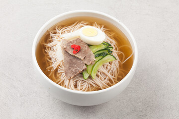 A food made by cutting cucumbers into small pieces, pickling them in salt or soy sauce, adding them to cold soup, and adding green onions, vinegar, sugar, and red pepper powder.