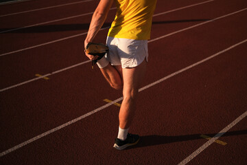  athlete warming up at the stadium before running