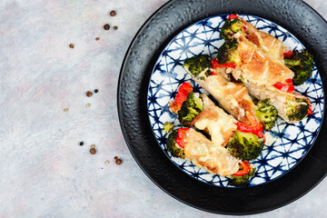 Meat rolls with broccoli and pepper.